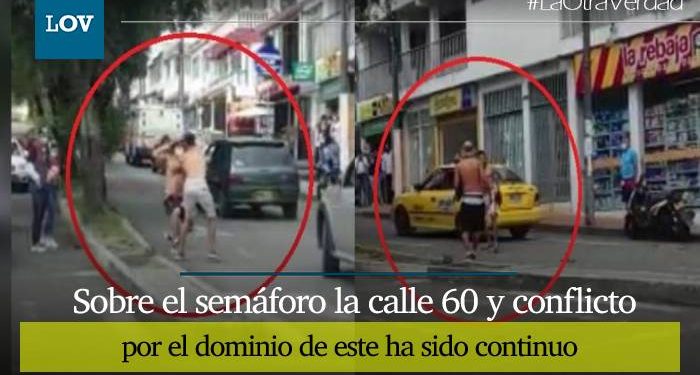 Limpia vidrios de la 60 se disputan el semáforo